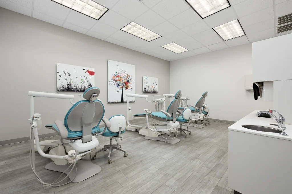 The image shows an interior view of a dental office with multiple dental chairs, dental equipment, and decorations on the walls.